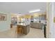Modern kitchen featuring an island, stainless appliances, and tile flooring at 9661 Sw 95Th Ct # B, Ocala, FL 34481