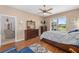 Bright bedroom with tile floors, a large window, and a view of the outdoors at 9663 Sw 92Nd Place Rd, Ocala, FL 34481