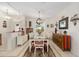 Inviting dining area featuring a stylish chandelier and ample natural light at 9663 Sw 92Nd Place Rd, Ocala, FL 34481