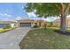 Single-story home with a well-manicured lawn, inviting curb appeal, and attached two-car garage at 9663 Sw 92Nd Place Rd, Ocala, FL 34481