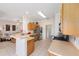 Efficient kitchen with wood cabinetry, stainless steel appliances, and an open layout connecting to the living area at 9663 Sw 92Nd Place Rd, Ocala, FL 34481
