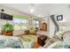 Comfortable living room with stylish decor, hardwood floors, and views of the landscape at 9663 Sw 92Nd Place Rd, Ocala, FL 34481