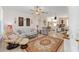 Cozy living room with comfortable seating, tile flooring, and decorative touches throughout at 9663 Sw 92Nd Place Rd, Ocala, FL 34481
