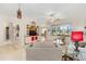 Spacious living room with an open layout, tile flooring, neutral walls, and large windows at 9663 Sw 92Nd Place Rd, Ocala, FL 34481