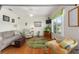 Comfortable living room with hardwood floors, vibrant decor, and large windows providing natural light at 9663 Sw 92Nd Place Rd, Ocala, FL 34481