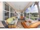 Screened porch with seating at 9663 Sw 92Nd Place Rd, Ocala, FL 34481