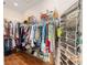 Well-organized walk-in closet with ample shelving, hanging space, and shoe storage at 9663 Sw 92Nd Place Rd, Ocala, FL 34481