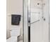 Modern bathroom features a tiled walk-in shower with a glass door and chrome fixtures at 9729 Sw 97Th St, Ocala, FL 34481