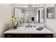Bathroom featuring a single sink vanity with dark wood cabinets and a white countertop at 9729 Sw 97Th St, Ocala, FL 34481