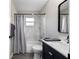 Remodeled bathroom features a tub with shower, modern vanity, and updated fixtures at 9729 Sw 97Th St, Ocala, FL 34481