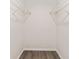 Walk-in closet features hardwood floors and a blank canvas for storage solutions at 9729 Sw 97Th St, Ocala, FL 34481