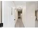 Hallway with wood-look flooring and neutral paint, leading to other rooms at 9729 Sw 97Th St, Ocala, FL 34481