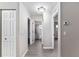 Hallway view with a light fixture and neutral walls at 9729 Sw 97Th St, Ocala, FL 34481