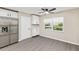 Kitchen area has stainless refrigerator and a large window at 9729 Sw 97Th St, Ocala, FL 34481