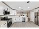 Bright, modern kitchen features stainless steel appliances, and seamless living space at 9729 Sw 97Th St, Ocala, FL 34481