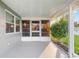 Covered patio leading to yard with attractive landscaping at 9729 Sw 97Th St, Ocala, FL 34481