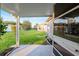 Covered patio with a view of the backyard and adjacent lawn at 9729 Sw 97Th St, Ocala, FL 34481