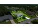 Aerial view of home with large lot, long drive, and screened-in pool at 11140 Sw 53Rd Cir, Ocala, FL 34476