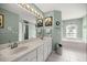 This bathroom features a double sink vanity and a soaking tub at 11140 Sw 53Rd Cir, Ocala, FL 34476