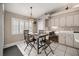 Cozy dining area with natural light, a modern chandelier and a table set for four at 11140 Sw 53Rd Cir, Ocala, FL 34476
