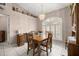 Inviting dining room featuring a chandelier, a table set for four, and shutters at 11140 Sw 53Rd Cir, Ocala, FL 34476