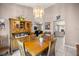 Comfortable dining room featuring a hutch and access to the living room and kitchen at 11140 Sw 53Rd Cir, Ocala, FL 34476