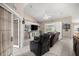 Bright living room features tile floors, neutral walls, and a modern ceiling fan at 11140 Sw 53Rd Cir, Ocala, FL 34476