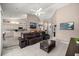 This living room features tile floors, high ceilings, and flows into the kitchen at 11140 Sw 53Rd Cir, Ocala, FL 34476