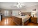 Spacious main bedroom with hardwood floors, ceiling fan and natural light at 11140 Sw 53Rd Cir, Ocala, FL 34476