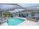 Screened in pool with hot tub and outside seating area at 11140 Sw 53Rd Cir, Ocala, FL 34476