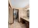 This bathroom has a double sink vanity and shower/tub with tile surround at 11230 Se 47Th Ave, Belleview, FL 34420