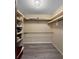A walk-in closet offers ample storage space with built-in shelving at 11230 Se 47Th Ave, Belleview, FL 34420