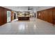 A spacious kitchen features a large island, tiled floor, and wooden cabinetry at 11230 Se 47Th Ave, Belleview, FL 34420