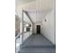 Covered front porch with stone detail, overhead lighting, and stairs at 11230 Se 47Th Ave, Belleview, FL 34420