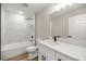 Bathroom featuring shower and tub, quartz countertop, and modern fixtures at 13314 Se 41St Ct, Belleview, FL 34420