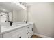 Modern bathroom featuring double sinks, quartz countertop, and stylish black fixtures at 13314 Se 41St Ct, Belleview, FL 34420