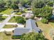 A high aerial view showcases the property, surrounding landscape and neighboring homes at 1404 Se 40Th Ct, Ocala, FL 34471