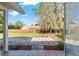 View of the backyard and patio from the covered patio at 1404 Se 40Th Ct, Ocala, FL 34471