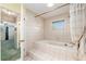 Large bathtub with tile surround and shower at 1404 Se 40Th Ct, Ocala, FL 34471