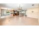 Bright, open living space featuring tile flooring with views to the kitchen and outdoor patio at 1404 Se 40Th Ct, Ocala, FL 34471