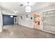 Bright living room featuring hardwood floors, modern lighting, and sliding glass doors to outside at 1404 Se 40Th Ct, Ocala, FL 34471