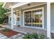 Relaxing covered patio with tiled floor and a large sliding glass door entrance at 1404 Se 40Th Ct, Ocala, FL 34471
