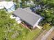 Bird's-eye view of the property featuring a well-maintained roof and backyard with a patio at 15917 Hidden Lake Cir, Clermont, FL 34711