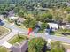 Aerial view of the property at 15917 with surrounding homes and mature trees at 15917 Hidden Lake Cir, Clermont, FL 34711
