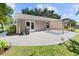 Spacious backyard patio area with a pergola, ideal for outdoor gatherings and relaxation at 15917 Hidden Lake Cir, Clermont, FL 34711