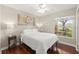 Bright bedroom features a ceiling fan and a sunlit window, creating a serene atmosphere at 15917 Hidden Lake Cir, Clermont, FL 34711