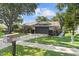 Home with mailbox in front and mature landscaping plus driveway that leads to a 2-car garage at 15917 Hidden Lake Cir, Clermont, FL 34711