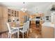 Bright kitchen with wooden cabinets, stainless steel appliances, hardwood floors, and pendant lighting at 15917 Hidden Lake Cir, Clermont, FL 34711