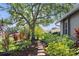 Professionally designed flower beds and pavers lead up to the side of the home at 15917 Hidden Lake Cir, Clermont, FL 34711