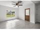 Bedroom featuring tile flooring, a large window and lots of natural light at 16062 Se 89Th Ter, Summerfield, FL 34491